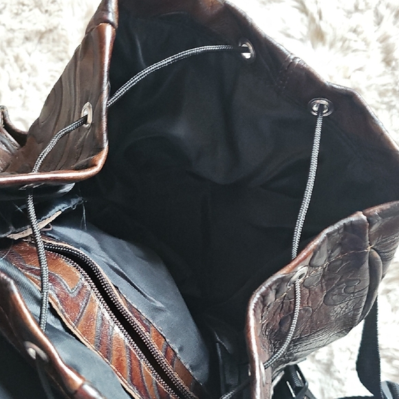 Elegant Brown Leather Backpack with Embossed Design - Picture 10 of 14